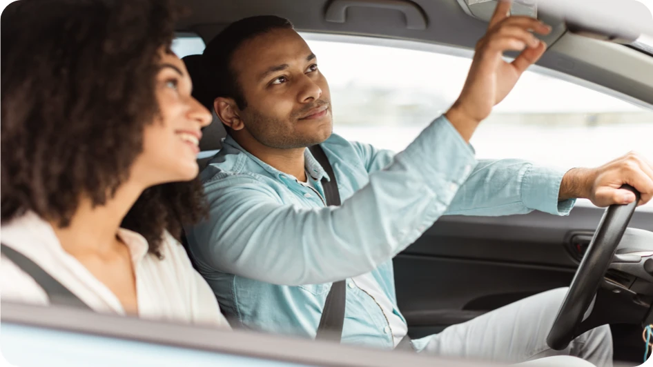 A couple test driving a vehicle